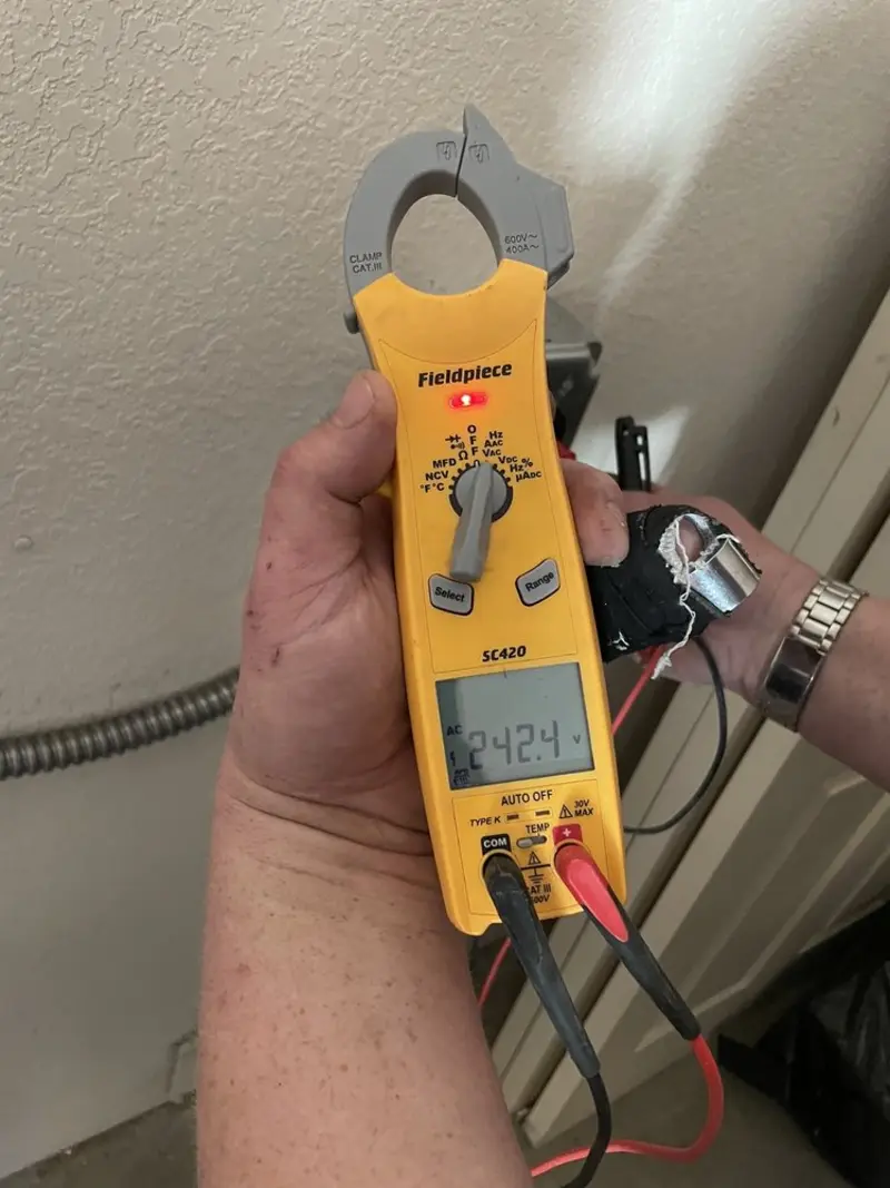 Voltage testing with clamp meter during Generator Installation in Everson